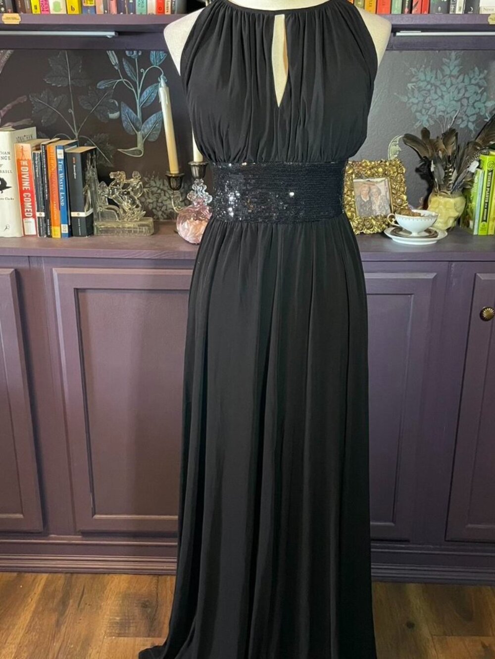 Elegant black evening gown with sequin embellishments